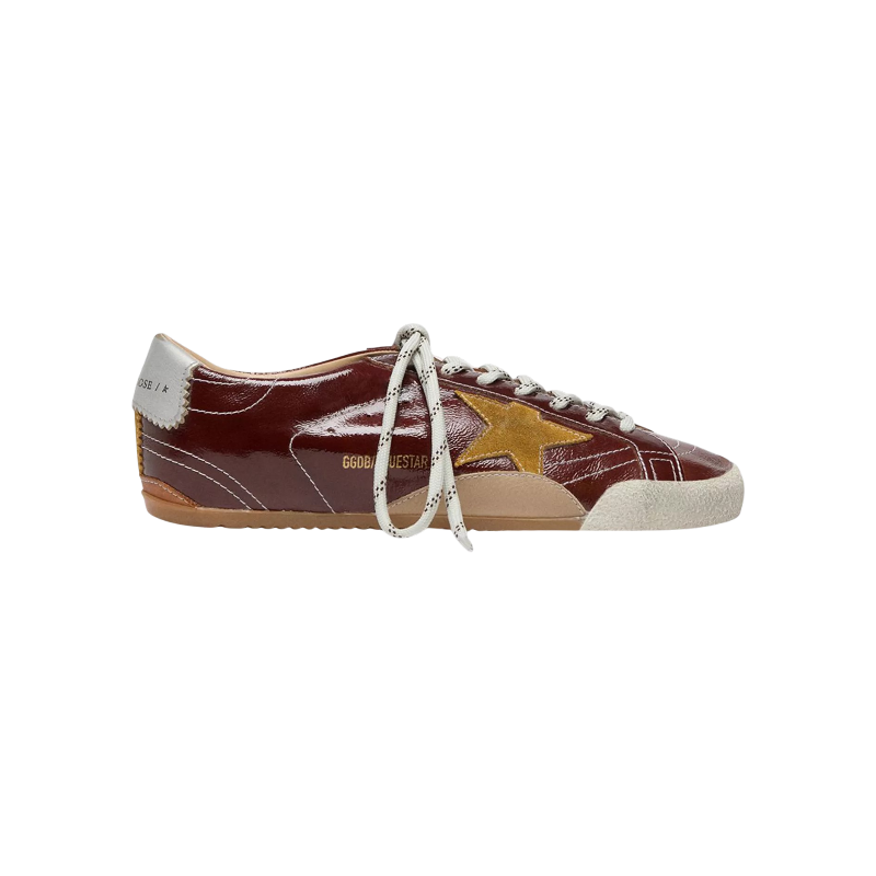 15559883_fpx Golden Goose True-Star sneakers featuring a shiny burgundy naplak leather upper and a contrasting yellow suede star - Image 1