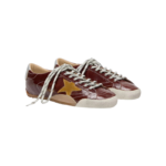 Golden Goose True-Star sneakers featuring a shiny burgundy naplak leather upper and a contrasting yellow suede star - Image 3