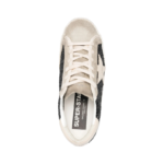 Golden Goose Super-Star sneakers feature black glitter uppers with a contrasting silver heel tab - Image 2