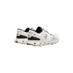 On Men's Cloud X 4 running shoes in white/black, featuring a distinctive CloudTec® sole and knitted mesh construction. - Image 2