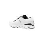On Men's Cloud X 4 running shoes in white/black, featuring a distinctive CloudTec® sole and knitted mesh construction. - Image 5