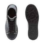 Alexander McQueen Oversized sneakers feature a sleek black calf leather upper contrasted by a bold white outline - Image 2