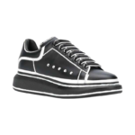 Alexander McQueen Oversized sneakers feature a sleek black calf leather upper contrasted by a bold white outline - Image 3
