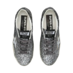 Golden Goose Super Star sneakers feature a silver glitter upper and signature leather star. - Image 5