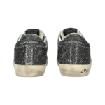 Golden Goose Super Star sneakers feature a silver glitter upper and signature leather star. - Image 6