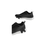 Hermès Bouncing sneakers in black with a distinctive white and black contrasting rubber sole - Image 4